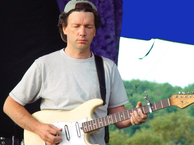 Steve playing the white Stratocaster guitar